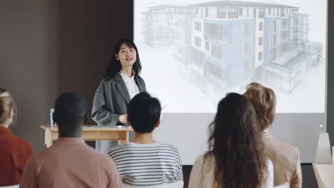 Asian-Woman-Presenting-Architectural-Project-on-Conference